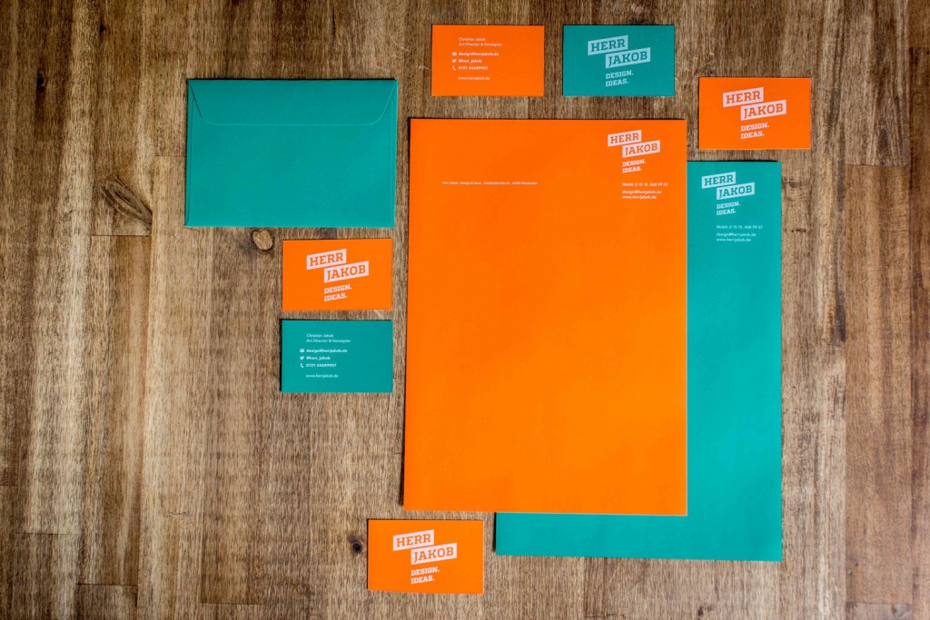 business cards, stationery and envelopes colorful design in orange and turquoise printed with ghost white toner