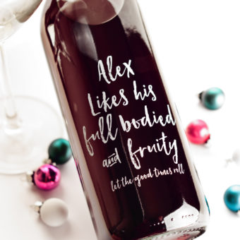 glass bottle with lettering in white