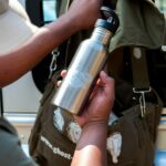 individually designed stainless steel bottle and bagpack with white toner