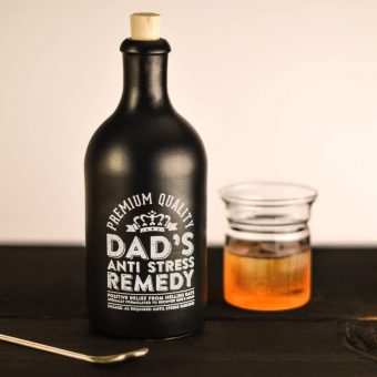 black bottle for gin with white toner printed lettering