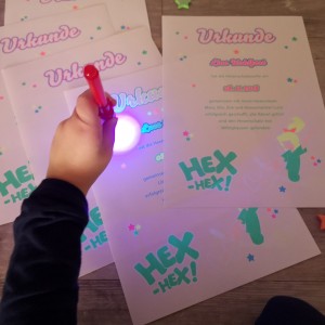 colorful papersheet with glow-in-the-dark effect printed with ghost neon toner