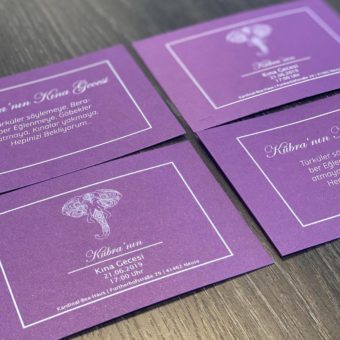 card invitation design with purple paper and white toner print