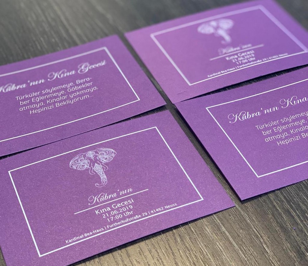 card invitation design with purple paper and white toner print